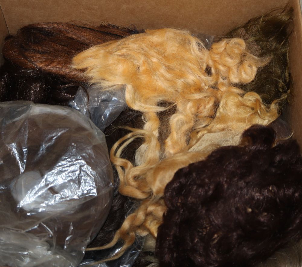 Twenty-six dolls wigs, vintage and new